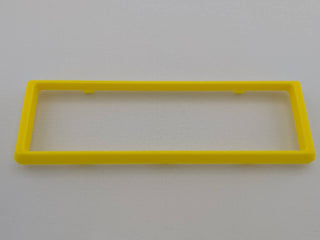 Yellow Alpine CD radio replacement bezel trim ring mounting tab close-up
