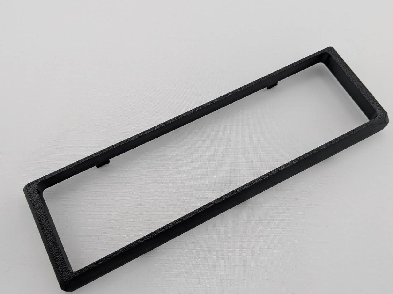 Black Alpine CD radio replacement bezel trim ring angled product view