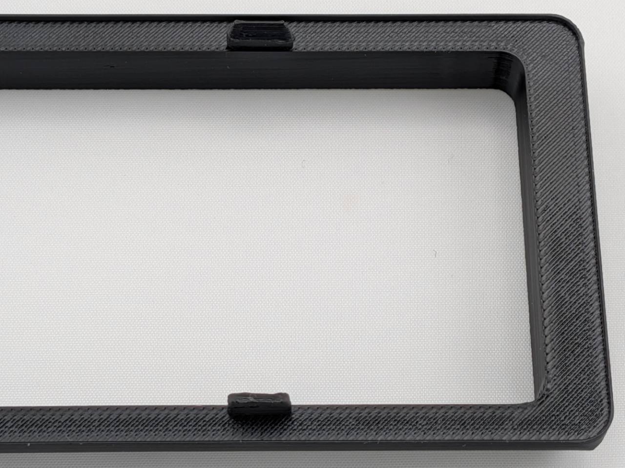 Black Alpine CD radio replacement bezel trim ring corner and texture detail