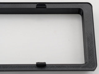 Black Alpine CD radio replacement bezel trim ring corner and texture detail