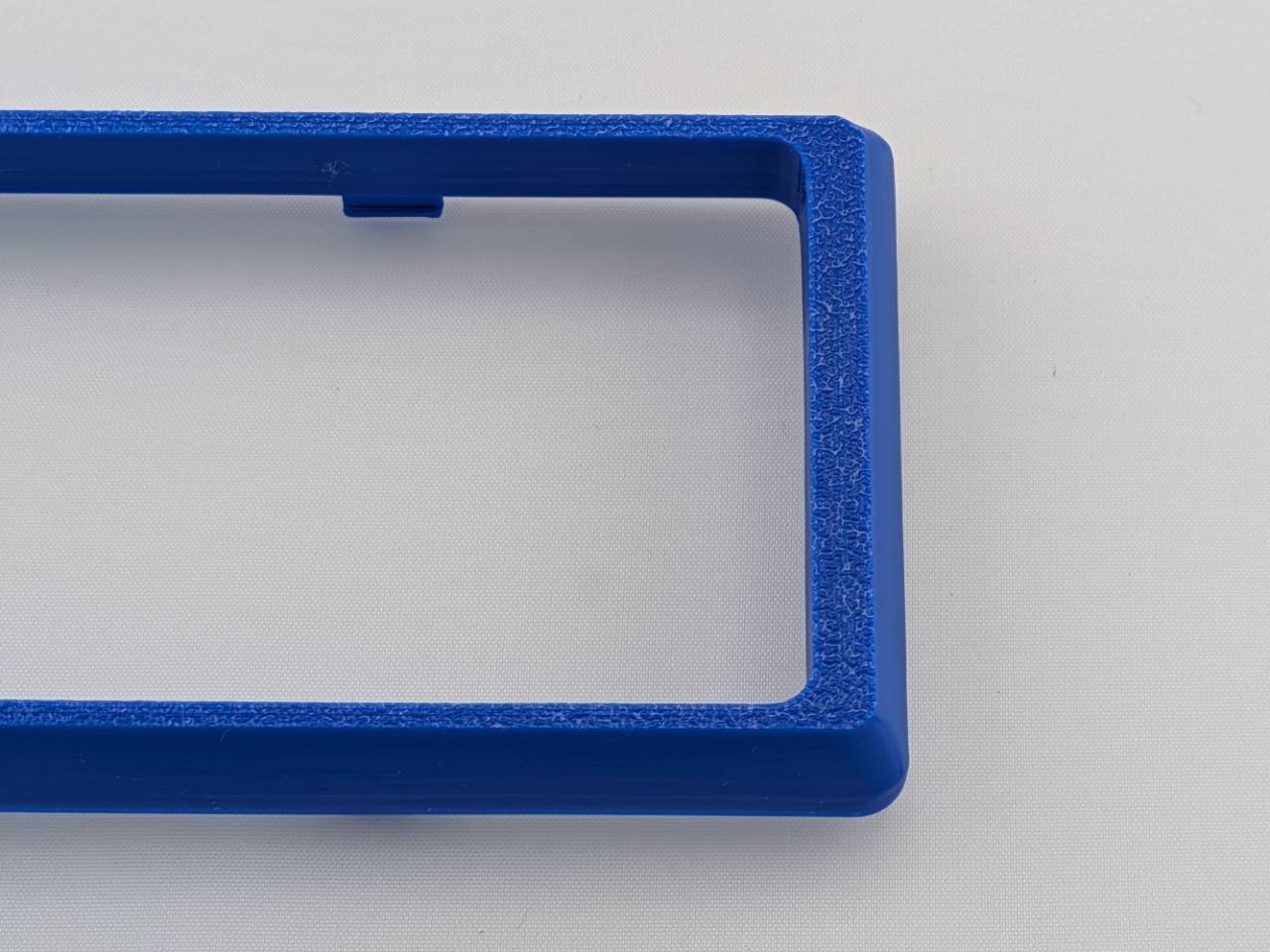 Blue Alpine CD radio replacement bezel trim ring surface texture detail