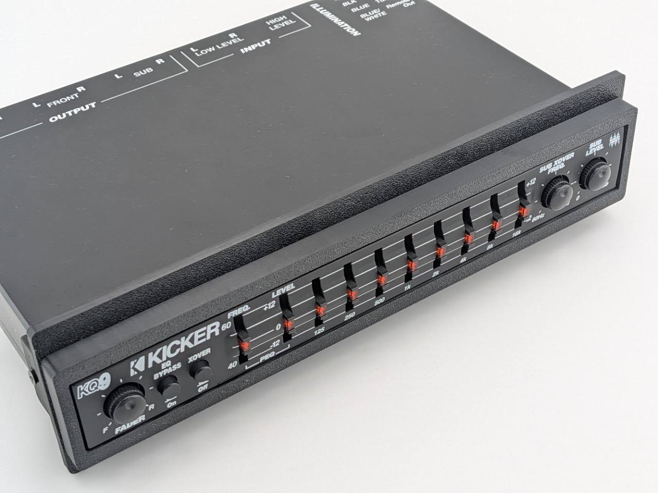 Kicker KQ9 equalizer with Black replacement faceplate and bezel installed, three-quarter fitment view; equalizer not included