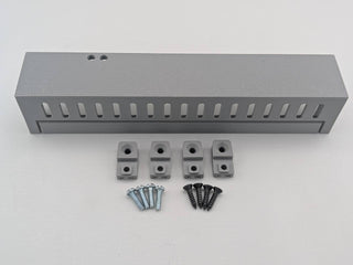 Gray Kicker amplifier cover mounting feet kit with four silver screws and four black screws