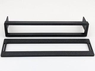Black example of the two TightPrints replacement pieces included with one order, faceplate and fitment-based bezel; equalizer is not included
