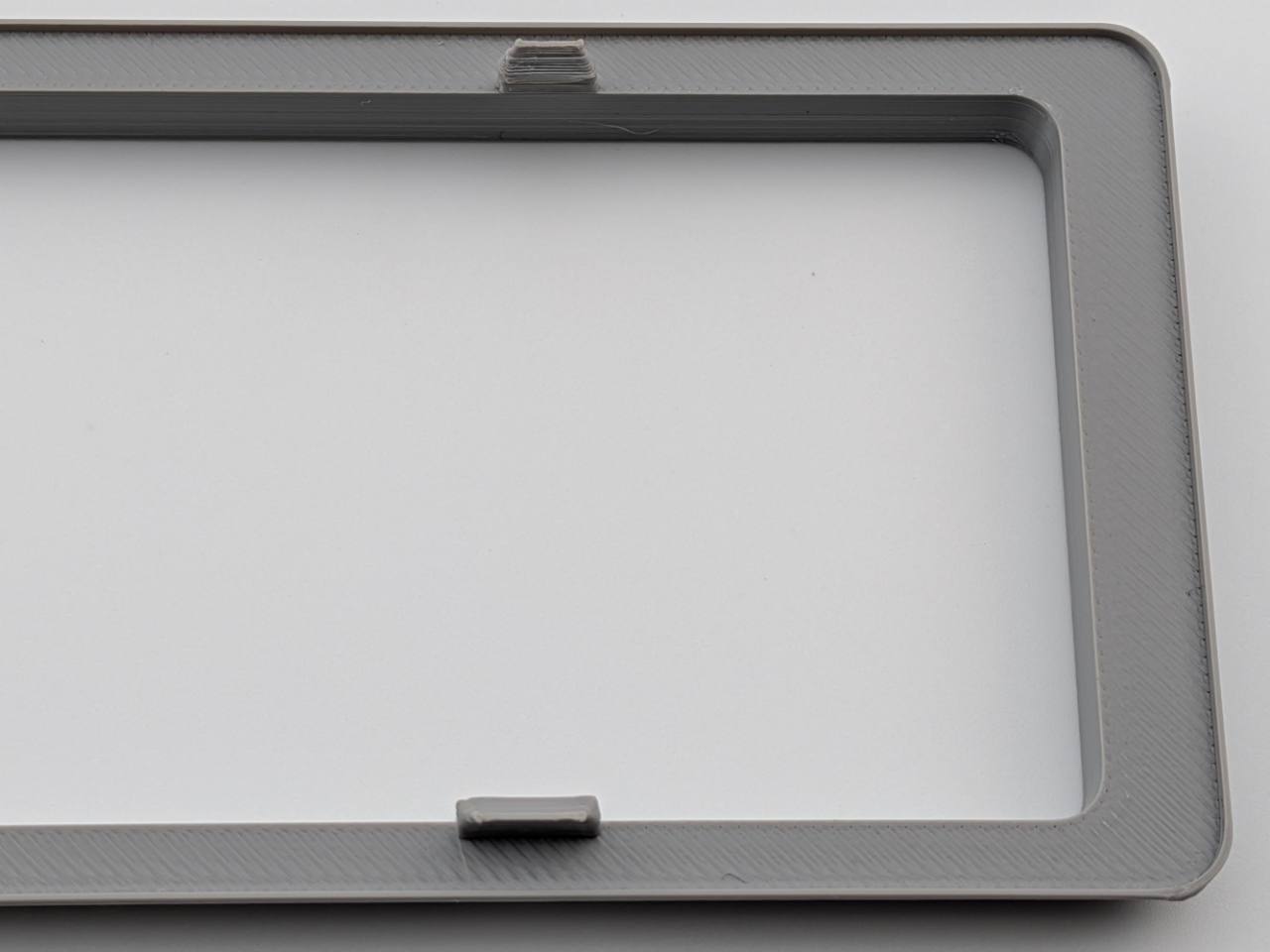Gray Alpine replacement trim ring inner lip and retention-tab close-up