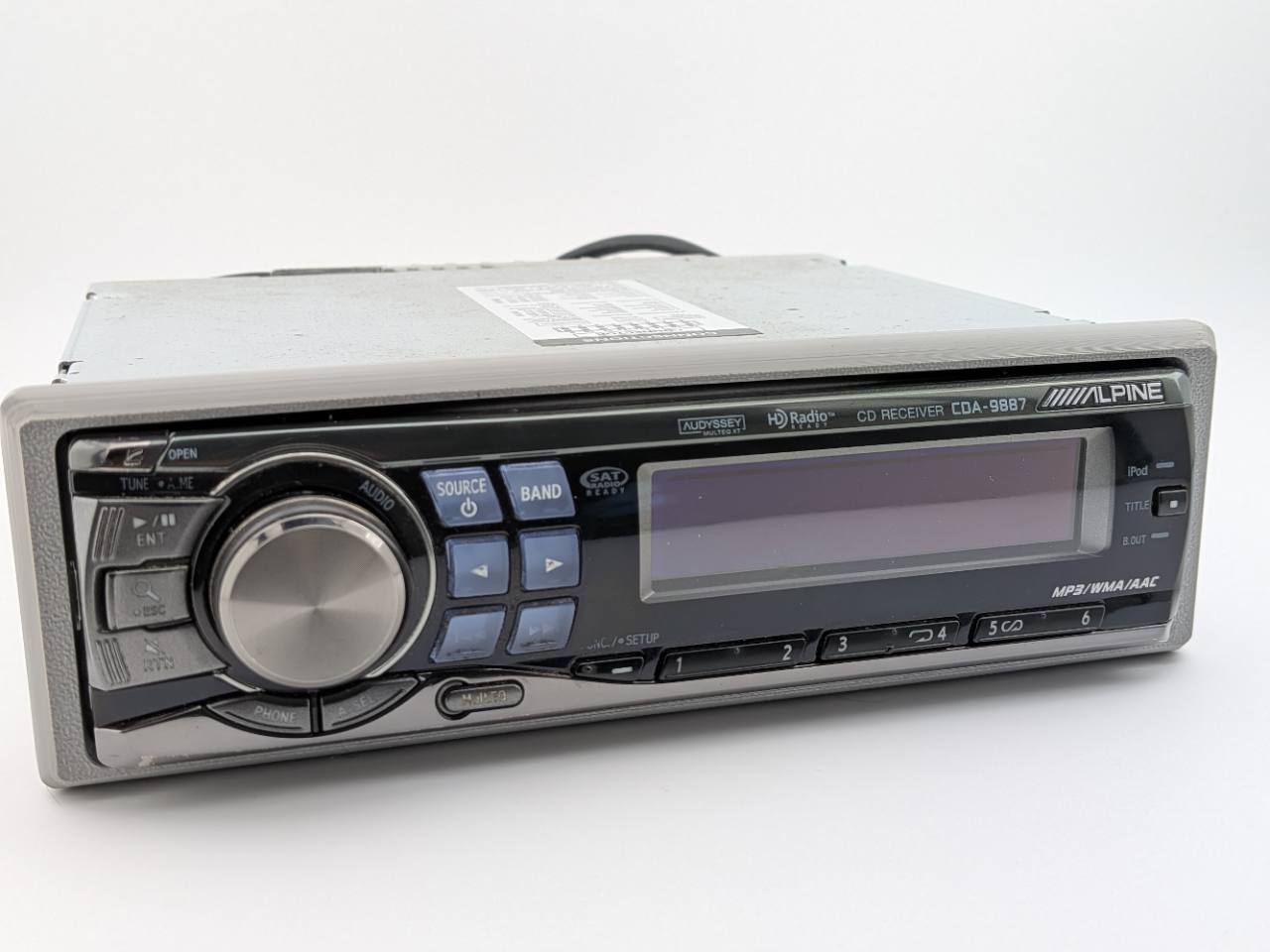 Gray replacement trim ring installed on an Alpine CDA-9887 receiver for fitment proof; receiver and electronics are not included