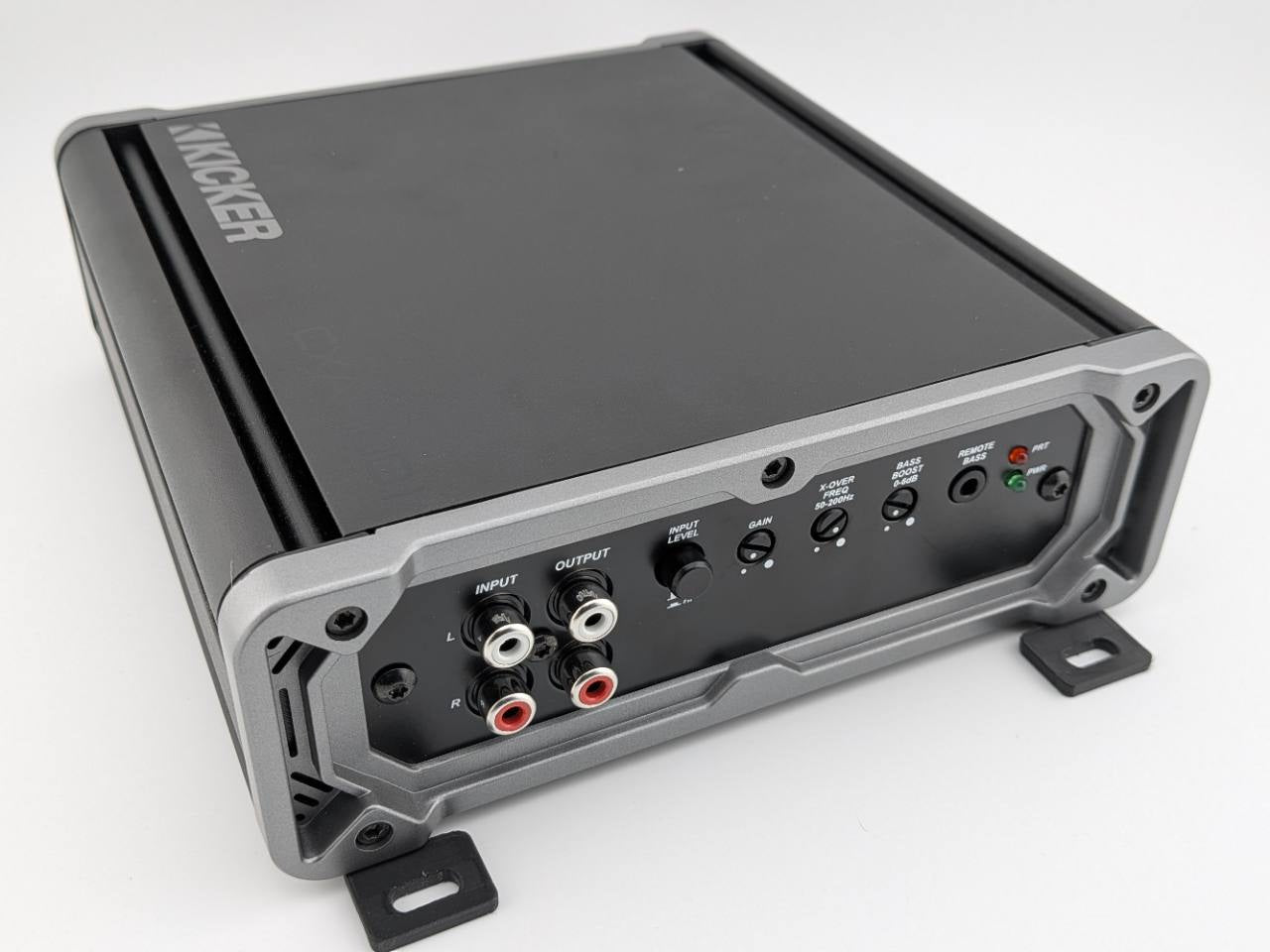 Black horizontal mounting feet shown at the front corners of a Kicker CXA400.1 amplifier; amplifier not included