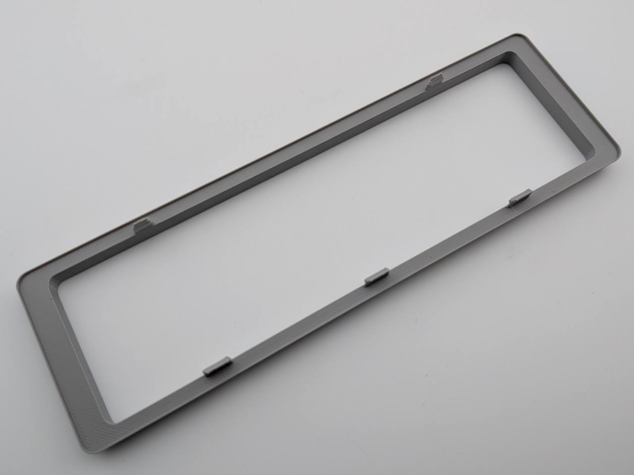Gray Alpine replacement trim ring rear construction and retention-tab detail