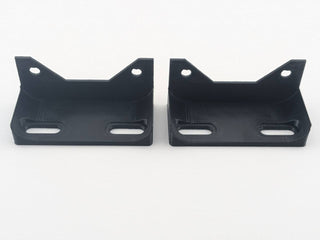 Two Black TightPrints vertical amplifier mounting feet viewed from the front, showing the amplifier attachment holes and mounting-surface slots