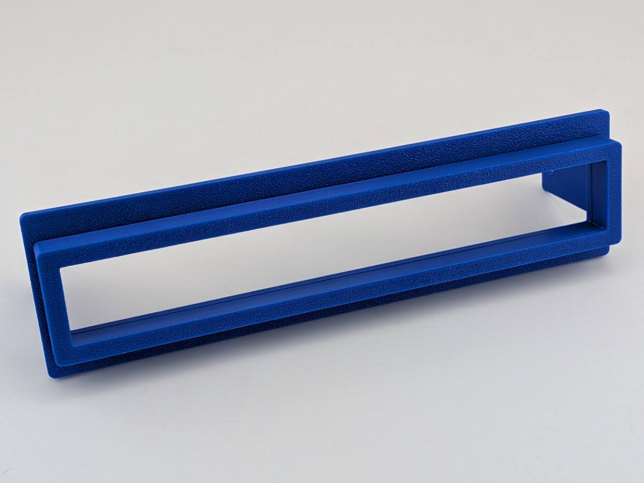 Blue TightPrints two-piece replacement faceplate and fitment-based bezel set for Alpine ERE-G180, G-180, 3318, 3331, and 3321, angled front view