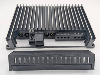 Compatible Kicker amplifier terminal area with the replacement cover removed; amplifier not included