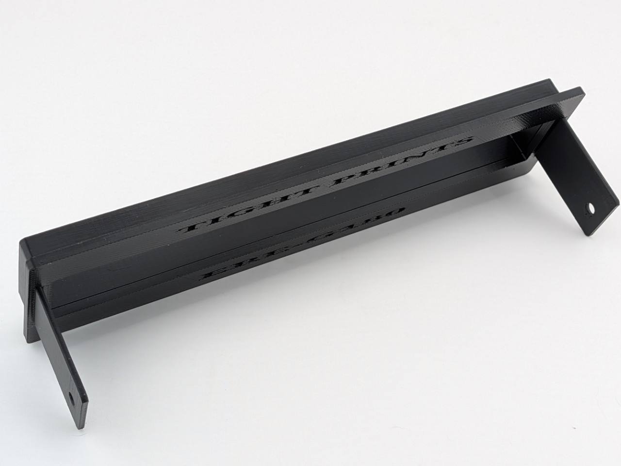Black TightPrints two-piece faceplate and fitment-based bezel rear mounting-tab and construction detail