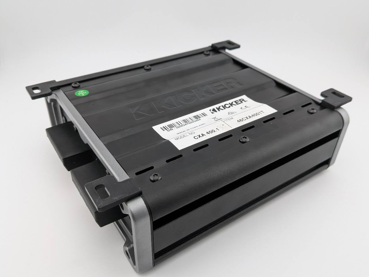 Rear and underside view showing all four Black horizontal mounting feet on a Kicker CXA400.1 amplifier; amplifier not included