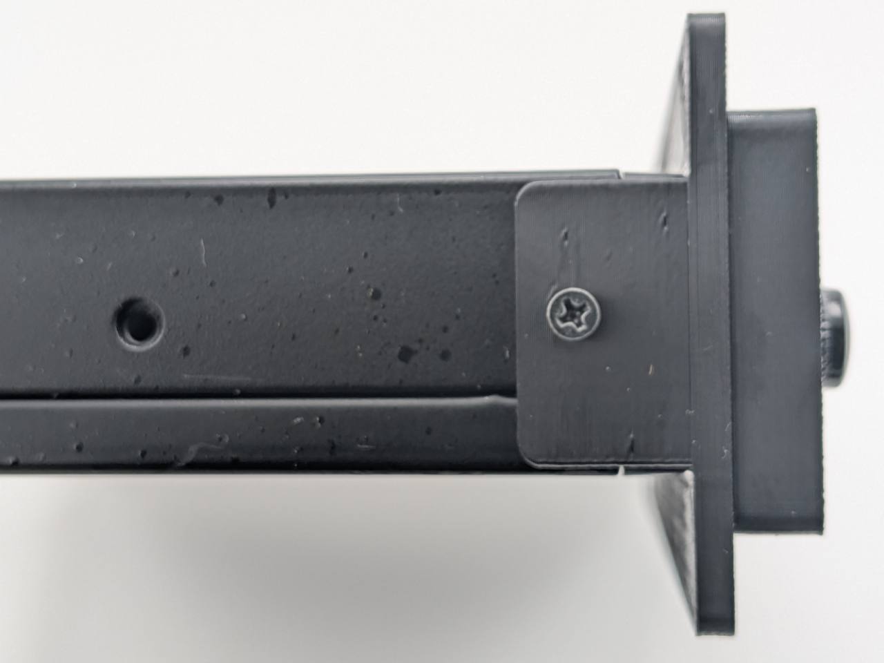 Black Kicker KQ9 replacement faceplate and bezel installed, side mounting-fit close-up; equalizer not included