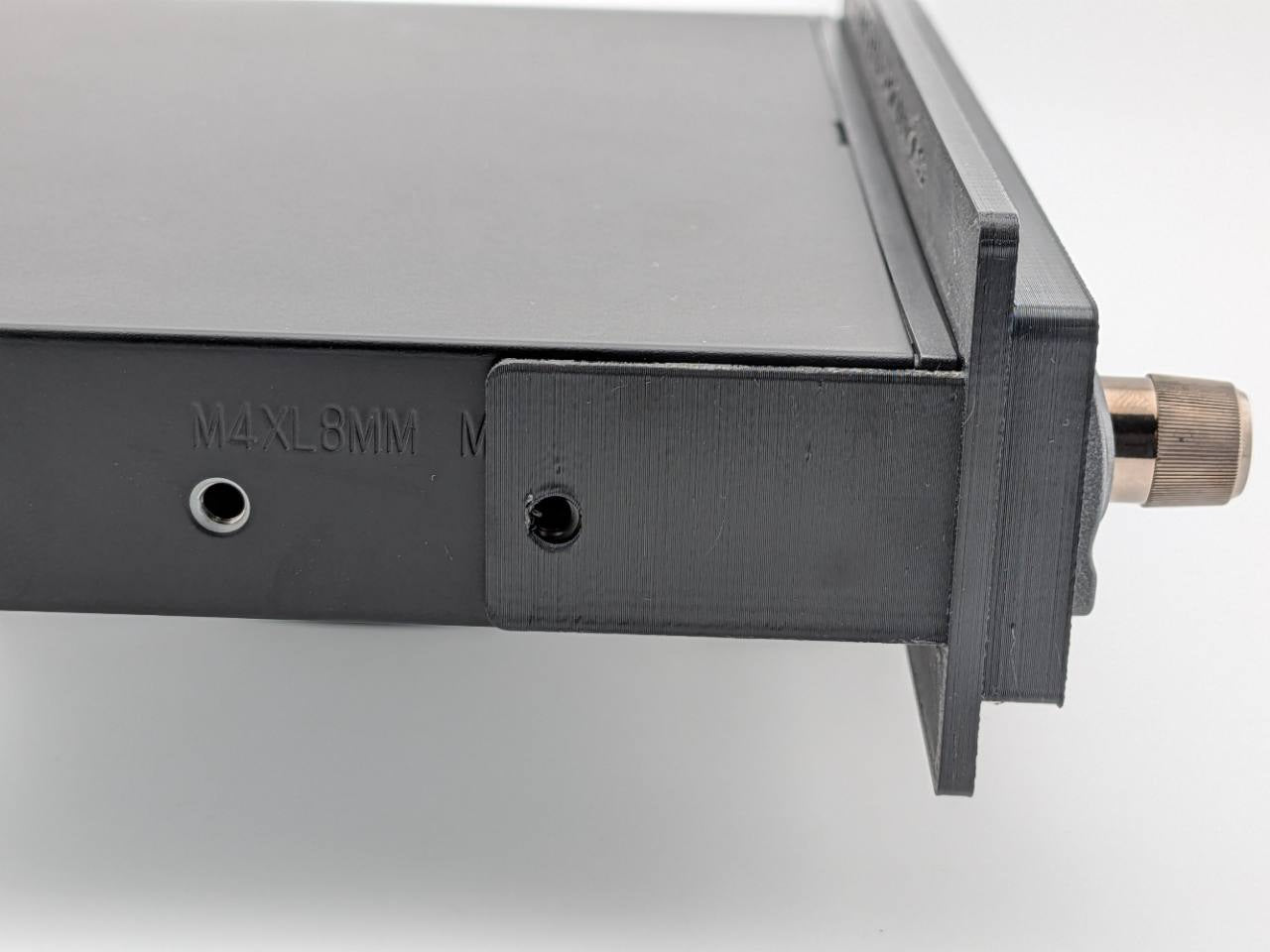 Close right-side fitment view of the Black TightPrints faceplate and bezel on an Alpine ERE-G190; equalizer shown for fitment only and not included