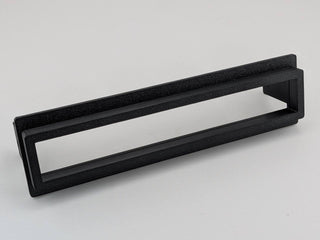 Black TightPrints two-piece replacement faceplate and fitment-based bezel set for Alpine ERE-G180, G-180, 3318, 3331, and 3321, angled front view