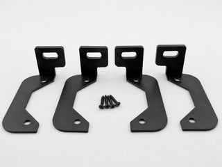 Four Black ABS horizontal amplifier mounting feet with four included mounting screws on a white background