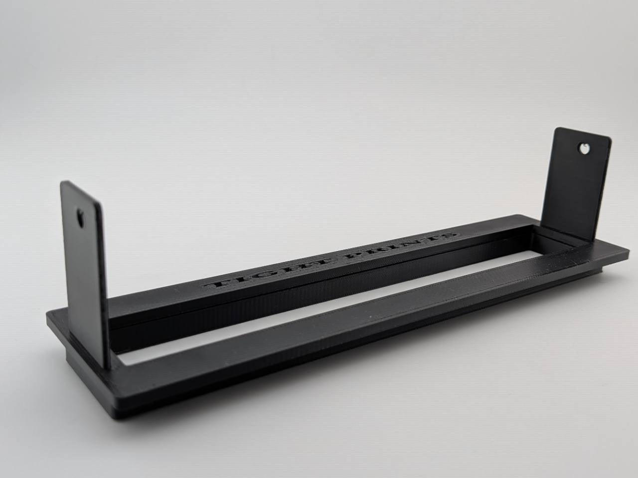 Angled product-only view of the Black TightPrints two-piece replacement faceplate and bezel set for the Alpine ERE-G190