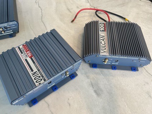 Customer photo of blue TightPrints replacement mounting feet on car audio amplifiers